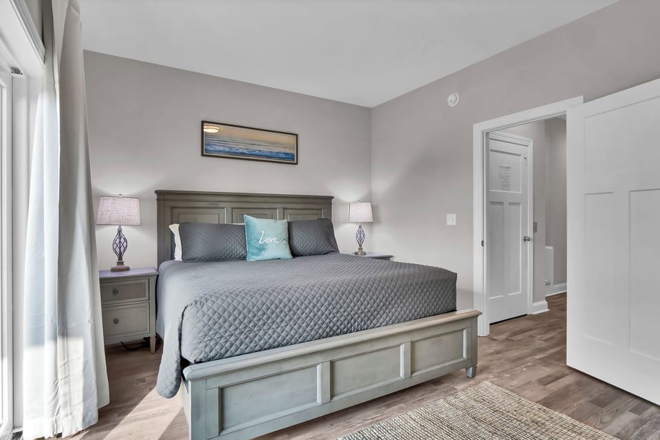 King bedroom , first floor sound side with deck access, TV & attached full bath