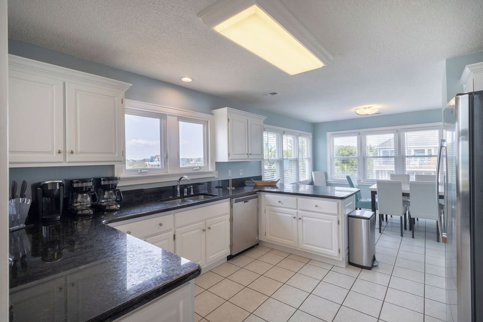 Kitchen - Stainless appliances, beautiful granite and bright windows this kitchen has it all.