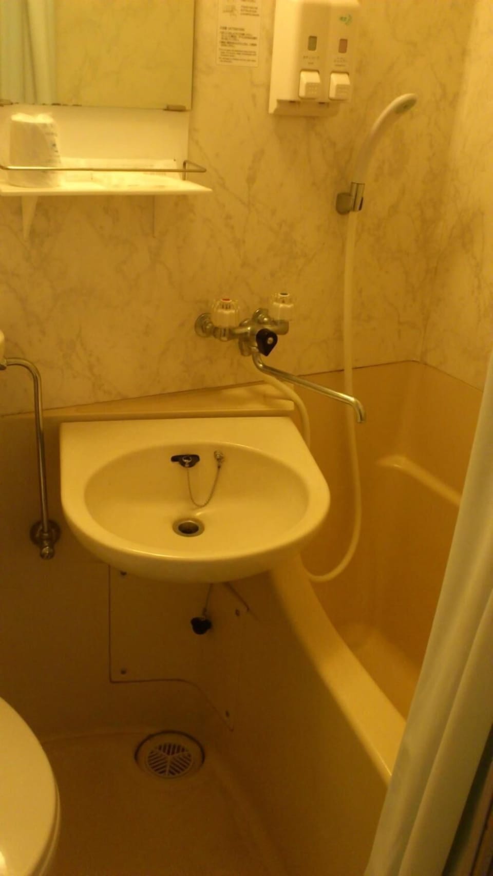 Combined shower/tub, free toiletries, hair dryer, slippers