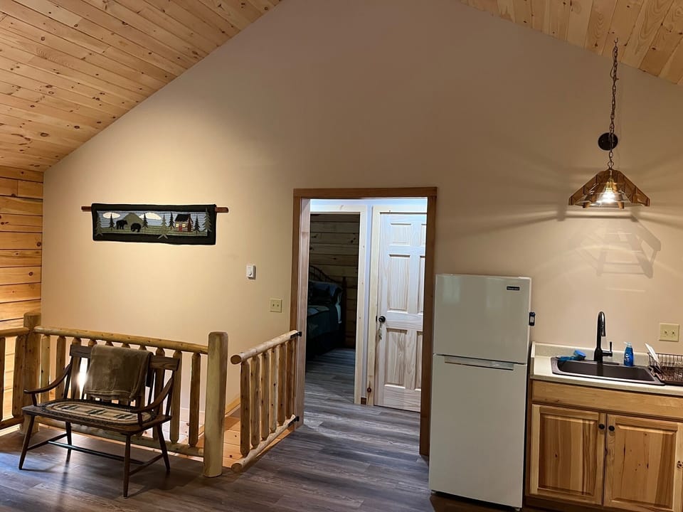 Hallway to Master bedroom and 2nd bathroom.  Stairway downstairs w/gate.