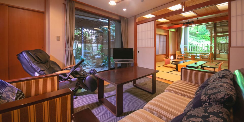Luxury Room, 2 Bedrooms, Smoking | Living area | 24-inch LCD TV with digital channels, TV