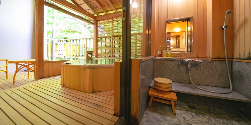 Luxury Room, 2 Bedrooms, Smoking | Bathroom | Combined shower/tub, free toiletries, hair dryer, slippers
