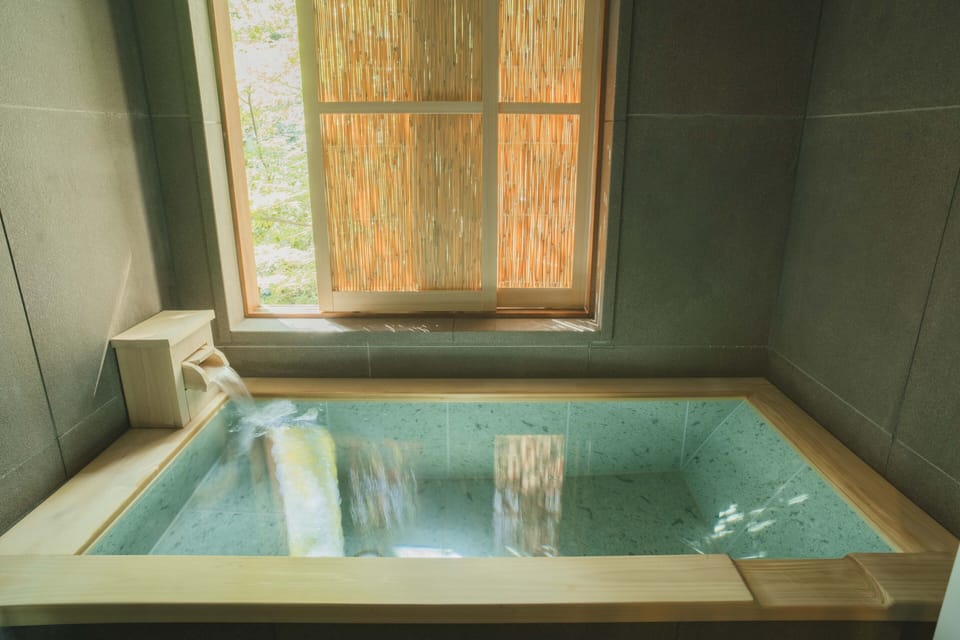 TSUYUKUSA Japanese-Style Triple Room with Garden View | Bathroom | Combined shower/tub, spring water tub, free toiletries, hair dryer