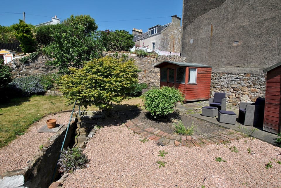 The tiered garden offers a sheltered space to enjoy the sunshine