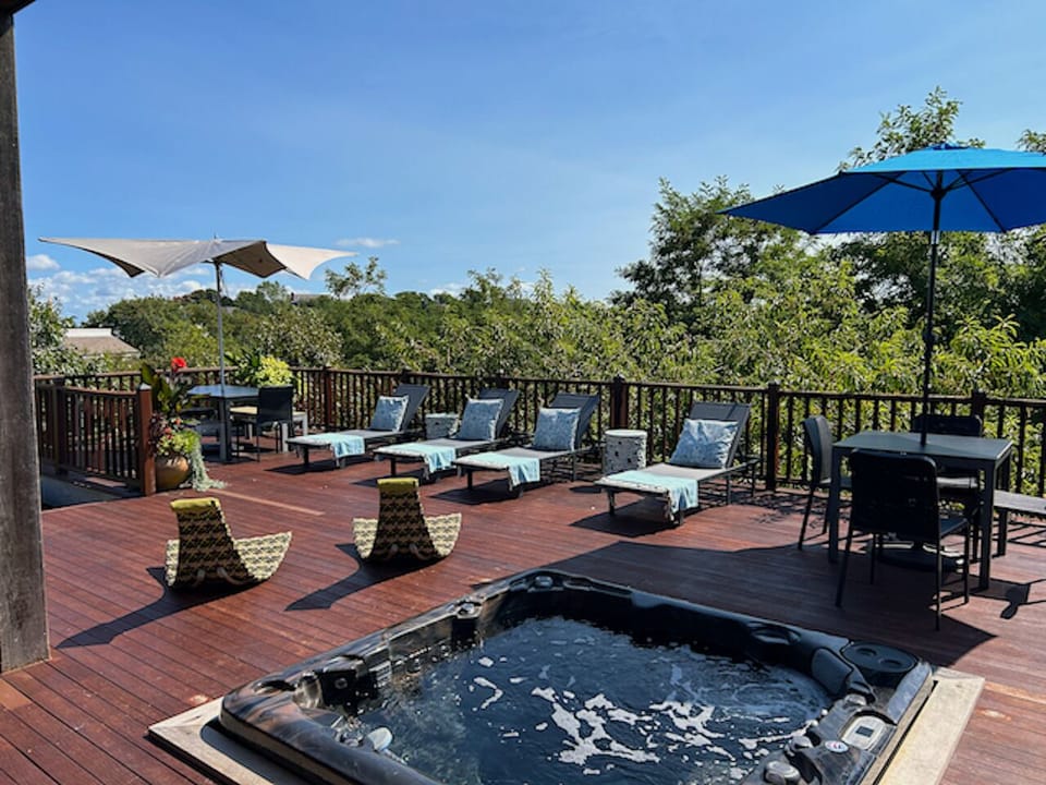 Choose from lounge chairs, shaded seating for dining, or the bubbling hot tub