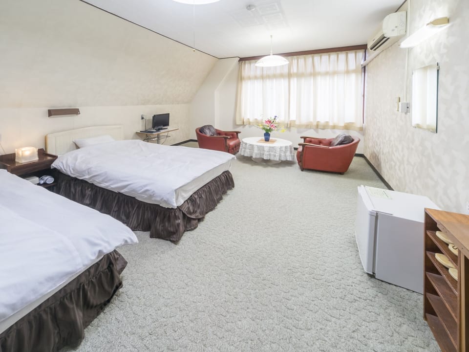 Twin Room, City View | In-room safe, desk, laptop workspace, blackout drapes