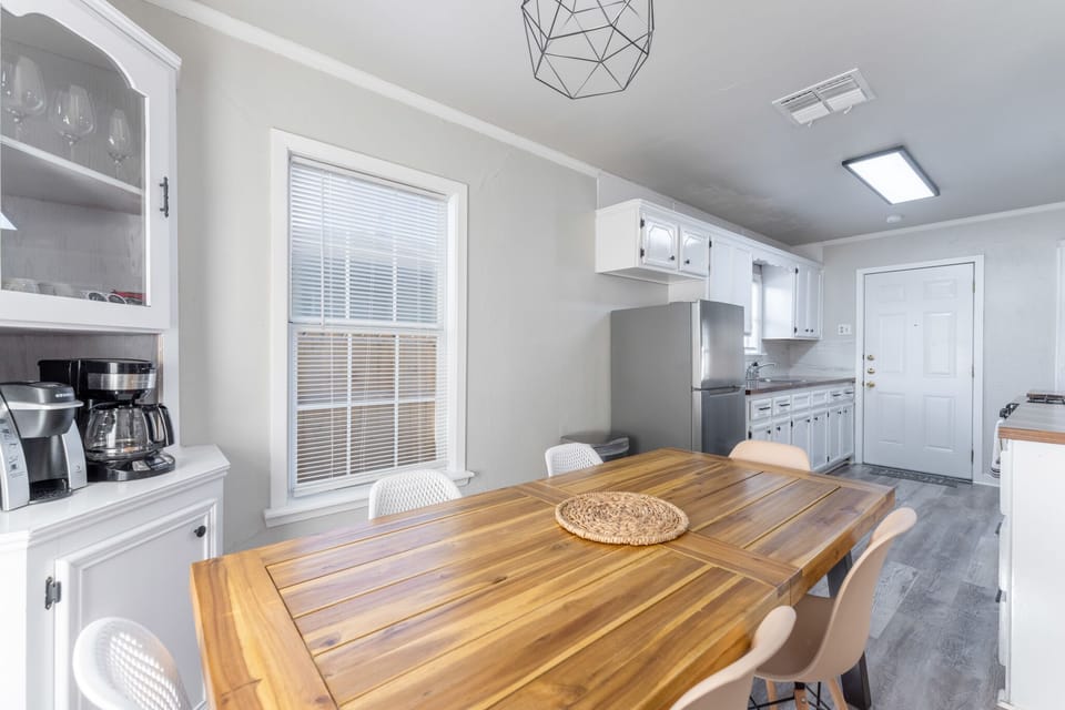 An elegant dining room awaits, offering plenty of space to savor every meal and create unforgettable memories with family and friends.