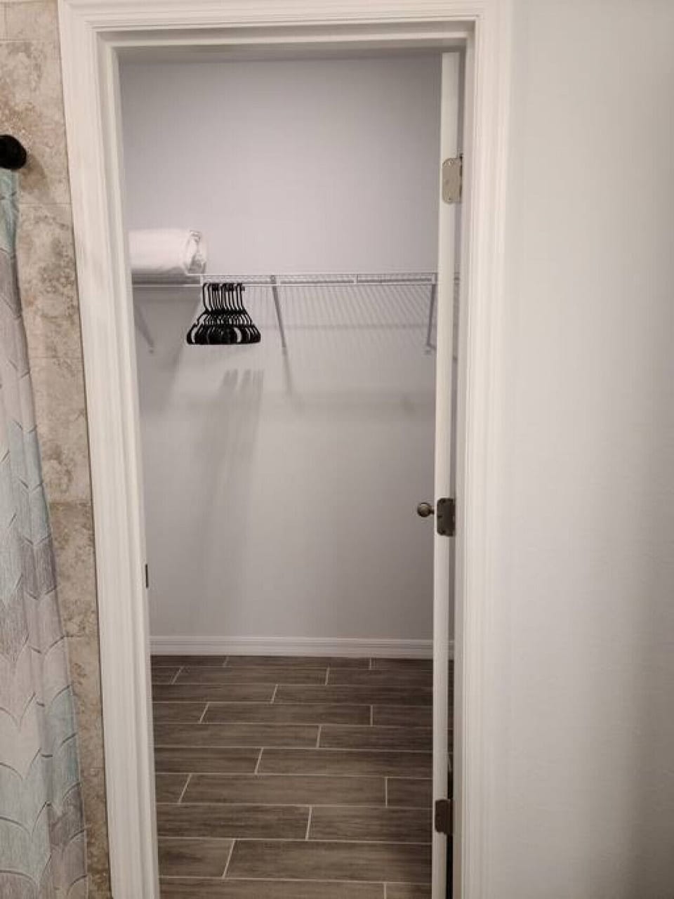 Walk-in closet off of primary bathroom