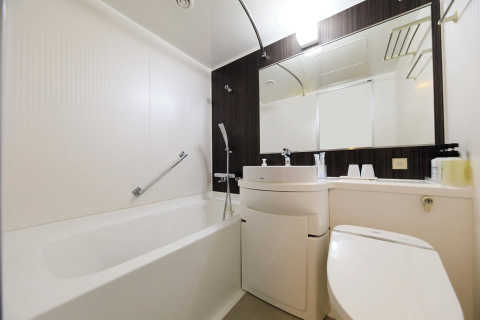 Japanese-style Twin Room, Non Smoking | Bathroom | Free toiletries, hair dryer (on request), slippers, towels