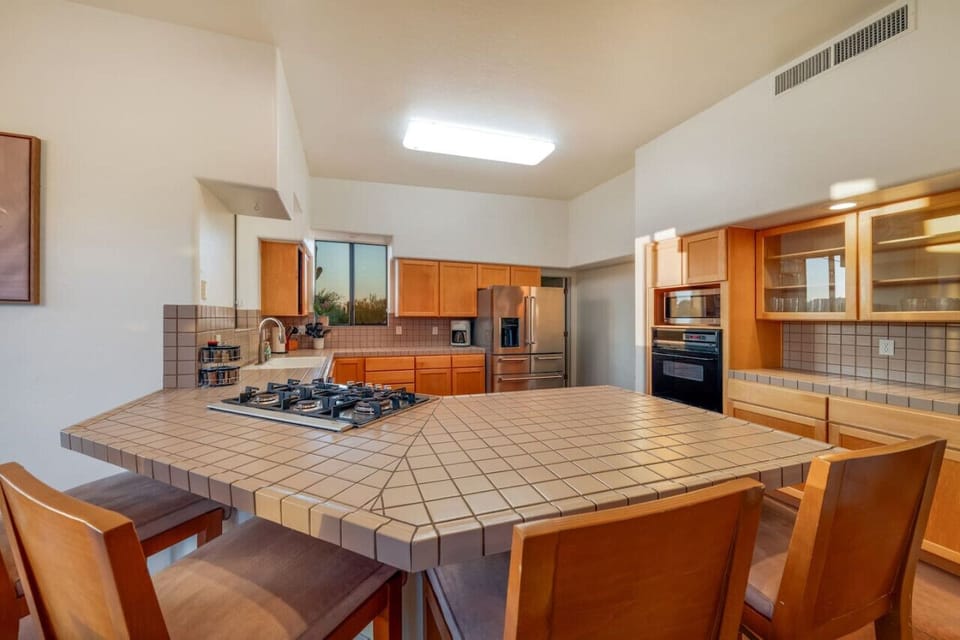 Spacious, well-equipped kitchen with large panty area and plenty of counter space and storage