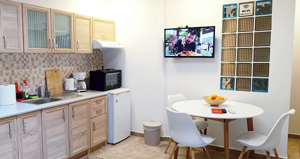 Kitchenette with coffee facilities , living room and a wonderful fireplace!