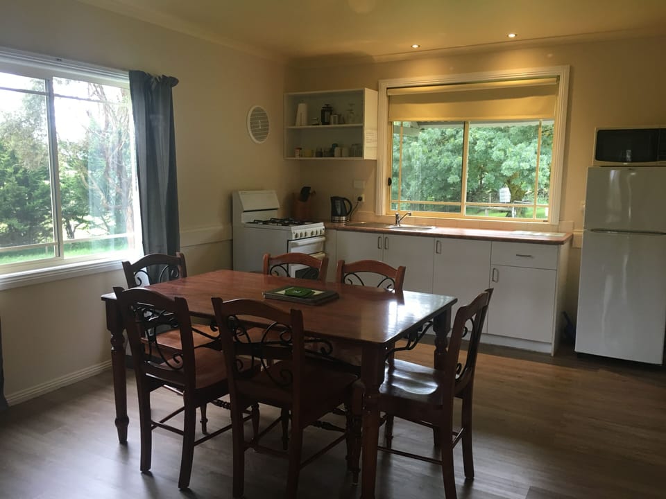 Deluxe Cottage, 2 Bedrooms, Pool View | Private kitchen | Fridge, microwave, stovetop, electric kettle