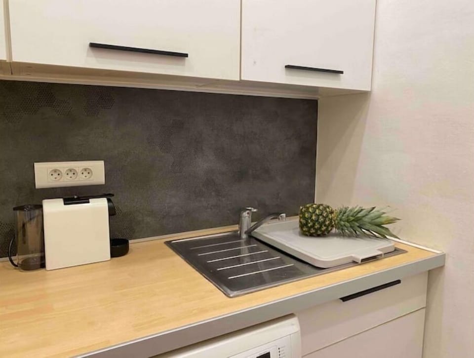 fresh pineapple from the very popular cassis farmer market. a nespresso machine.