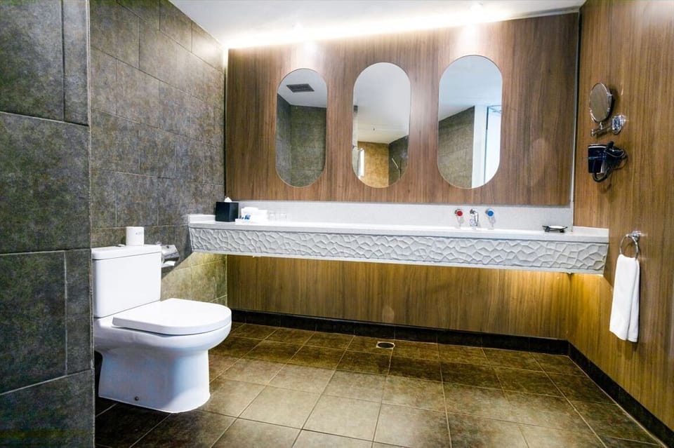 ASTON Suite | Bathroom | Shower, free toiletries, towels