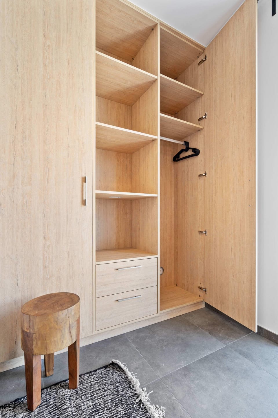 Spacious built-in closet with ample storage space, perfect for keeping your belongings organized during your stay.