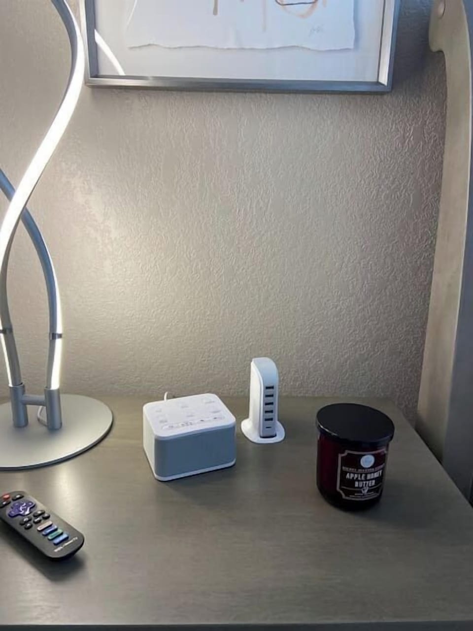 The bedroom comes with a nightstand light, a 5 port USB connection stand, and a white noise sleeping machine. 