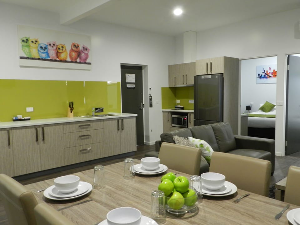 Deluxe Apartment, 4 Bedrooms | Living area | 42-inch LCD TV with digital channels, TV