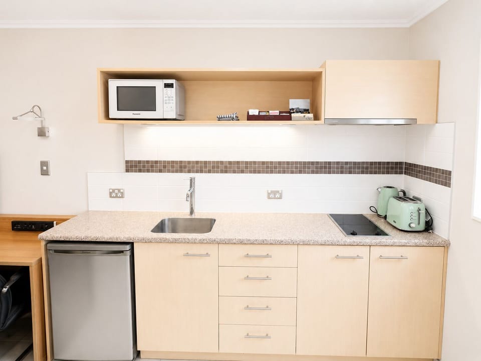 Microwave, stovetop, coffee/tea maker, electric kettle