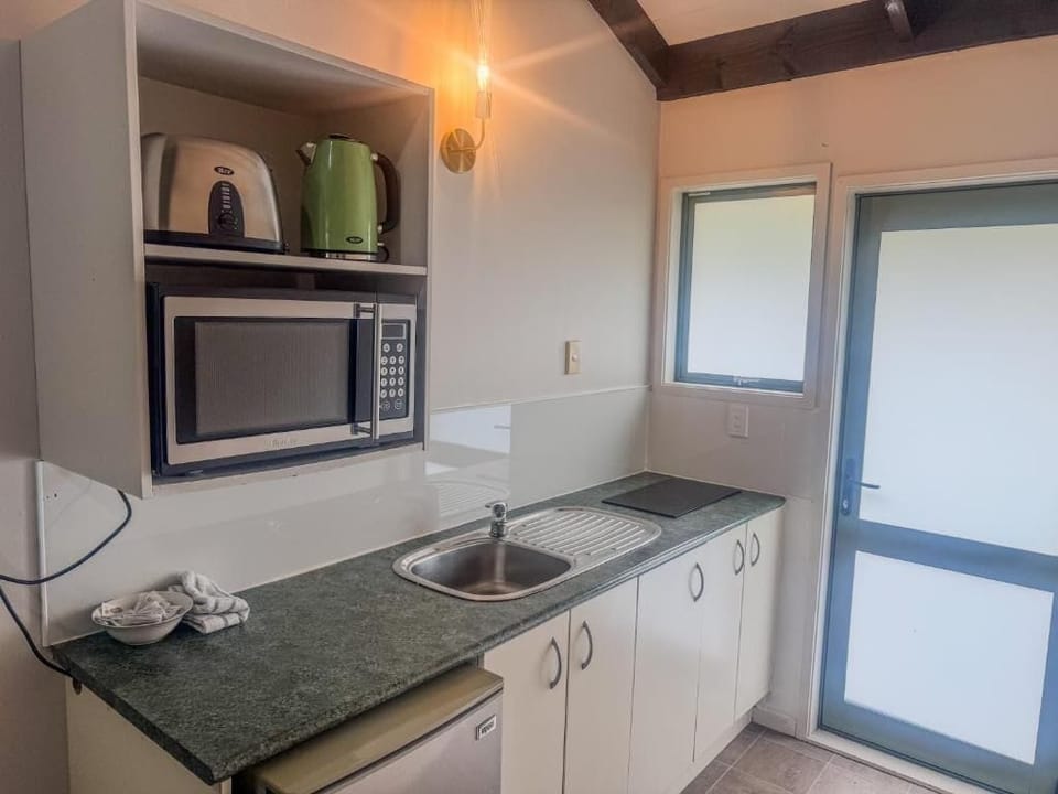 Microwave, stovetop, coffee/tea maker, electric kettle