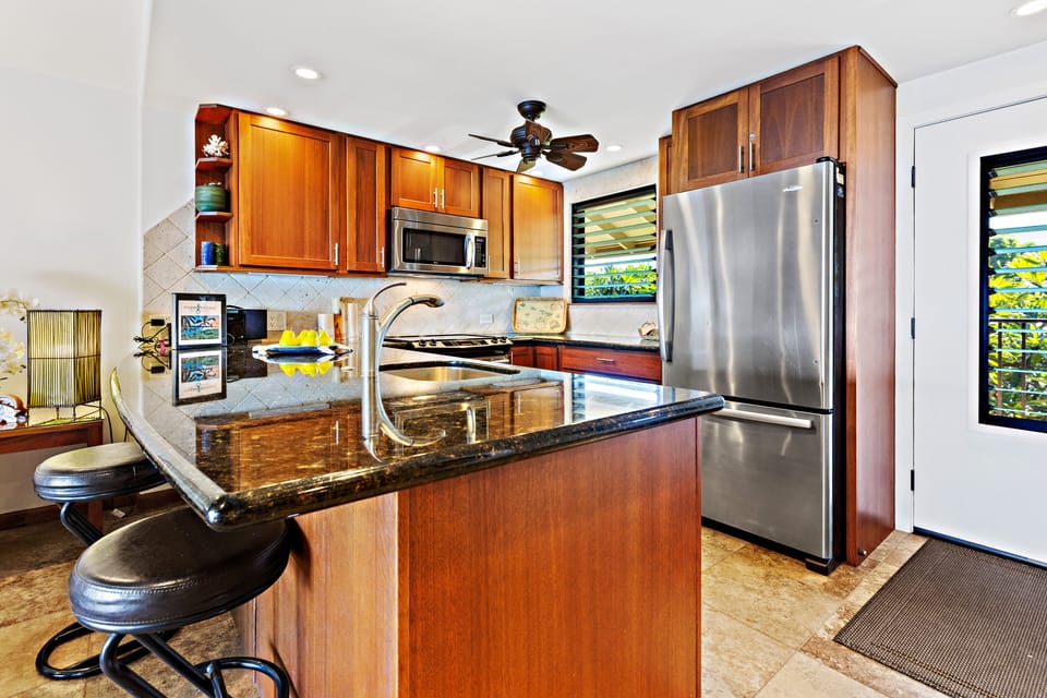 Gorgeous, remodeled kitchen featuring stainless appliances, custom cabinets and granite countertops