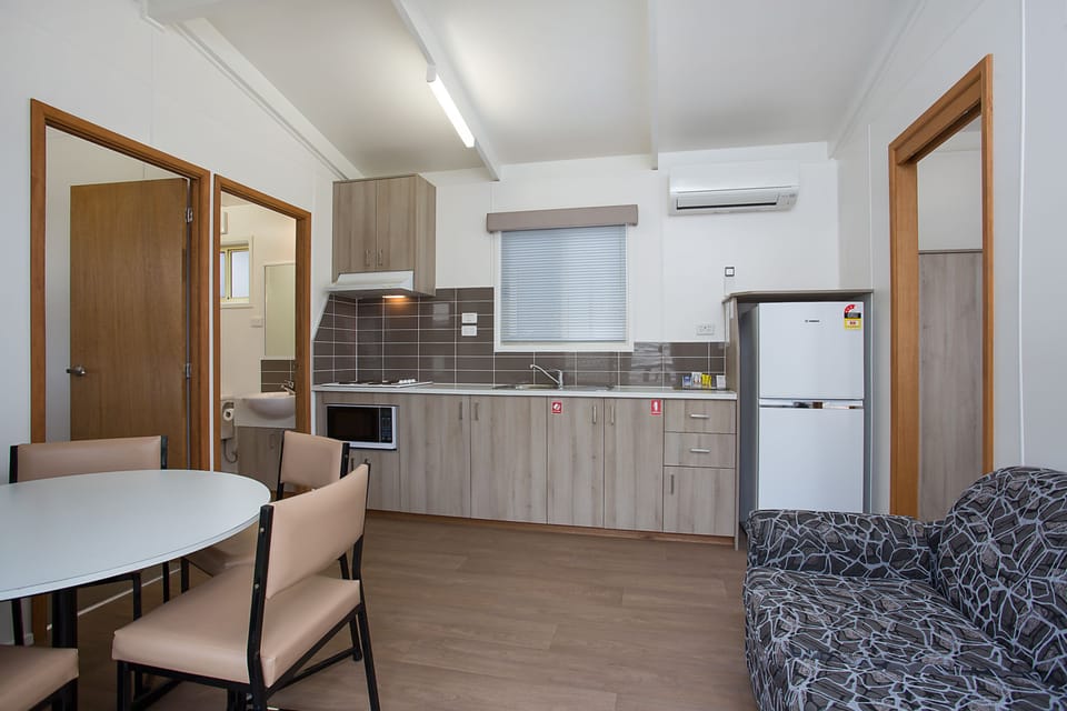 Superior 2 Bedroom Villa Sleeps 6  (Twin share linen surcharge applies & payable at property) | Living room | 60-inch TV with digital channels, DVD player