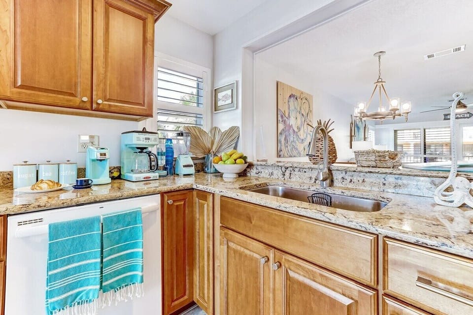 Modern kitchen appliances that reflect the beautiful color of our beach's waves.