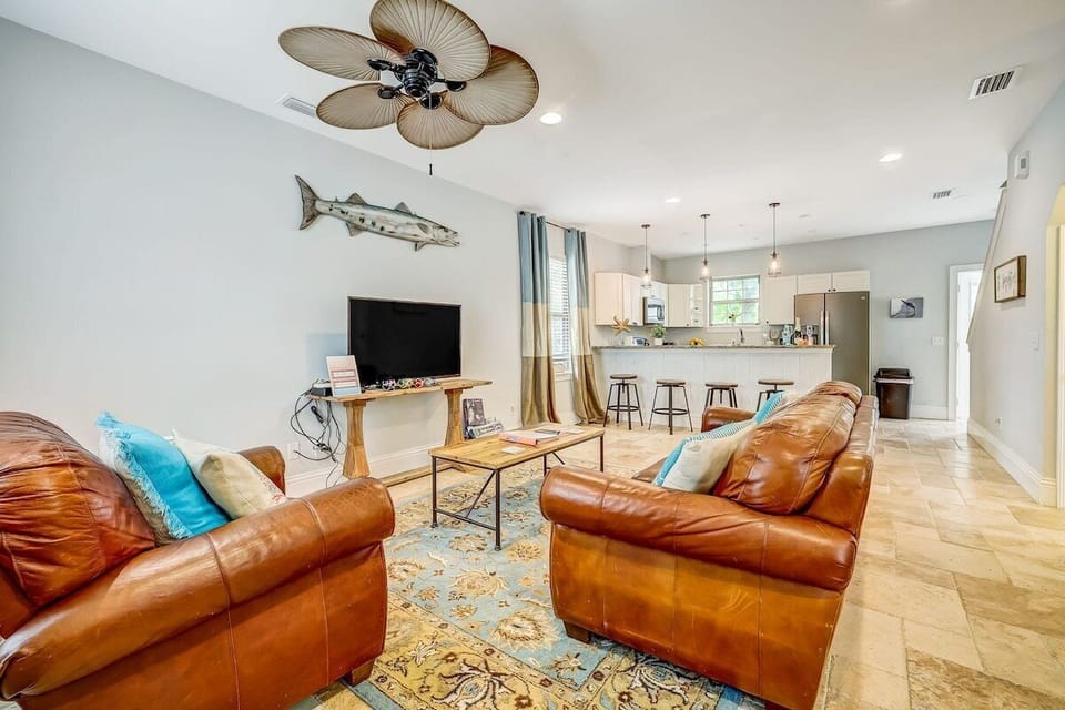 Living room space with comfortable leather couches.
