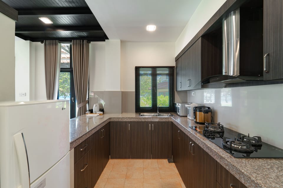 Villa, 4 Bedrooms, Sea View | Private kitchen | Coffee/tea maker, fridge, electric kettle, dining table