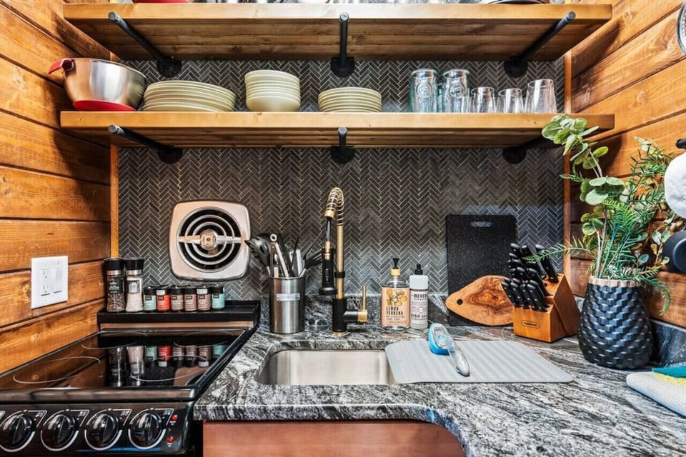 Compact kitchen packed with the essential amenities for a cooking experience