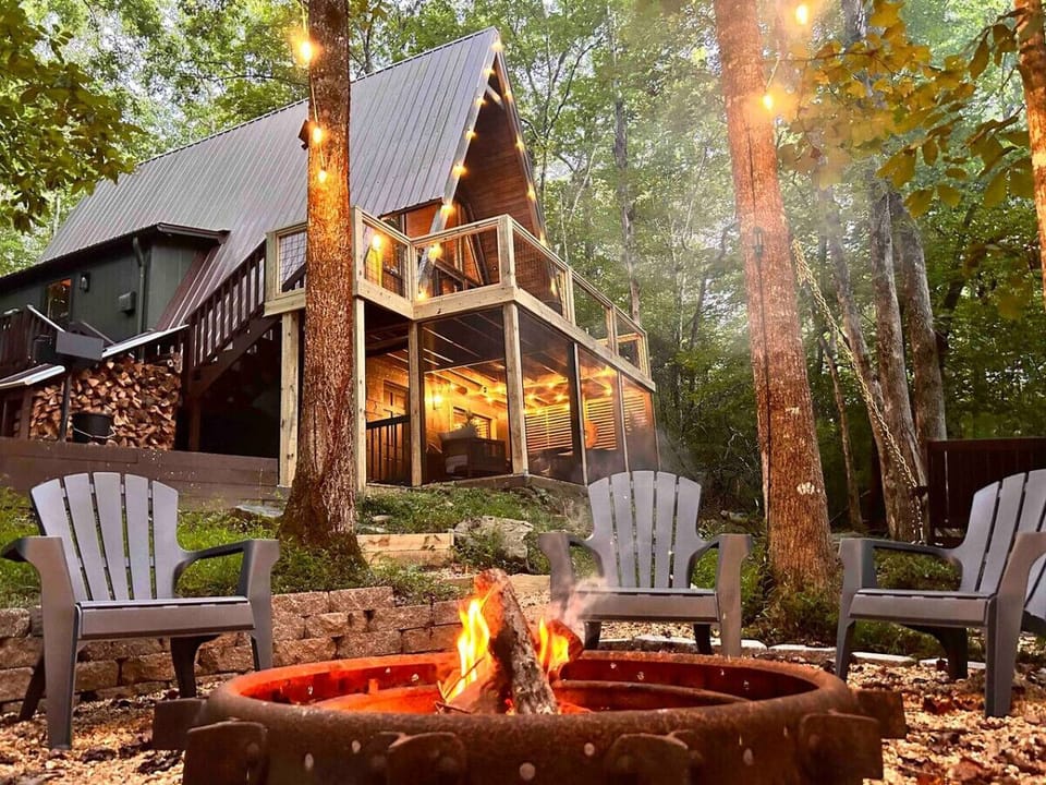 Cozy evenings by the creekside fire pit where nature`s tranquility meets the warmth of the flames