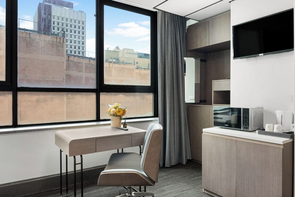 Premium Room, 1 King Bed | Living area | TV