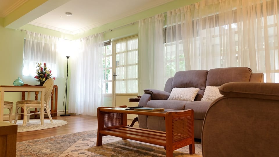 Premium Apartment, 1 Bedroom, Garden View | Living area | LCD TV, DVD player