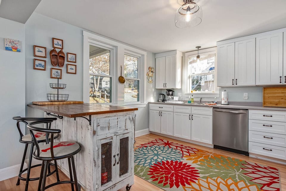 Spacious and modern kitchen with guest amenities and breafast bar seating