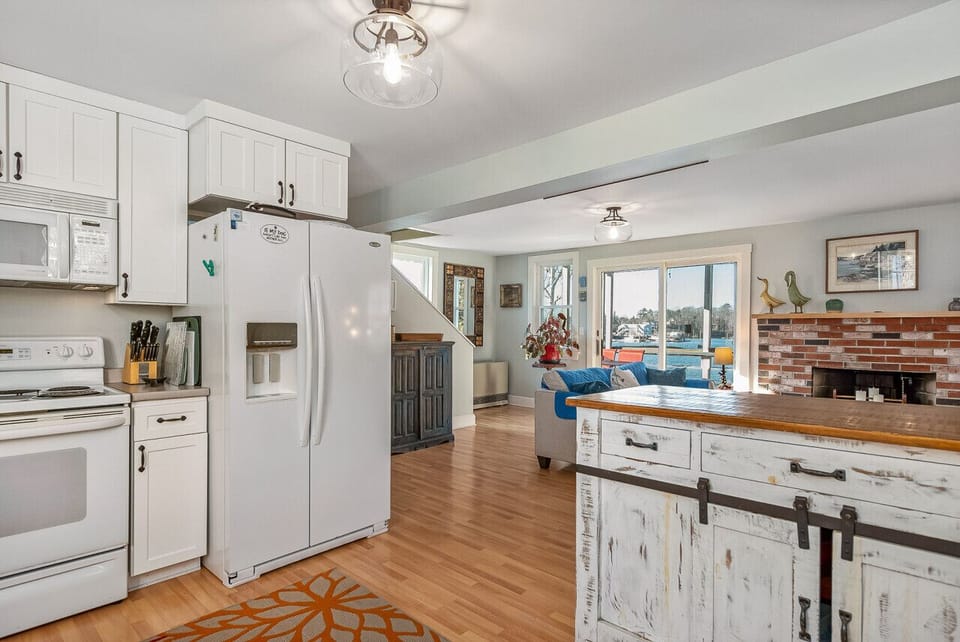 Spacious and modern kitchen with guest amenities and breafast bar seating