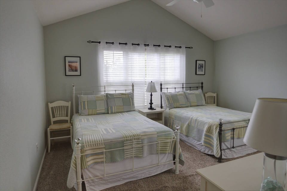 Bedroom #2 with two full beds.