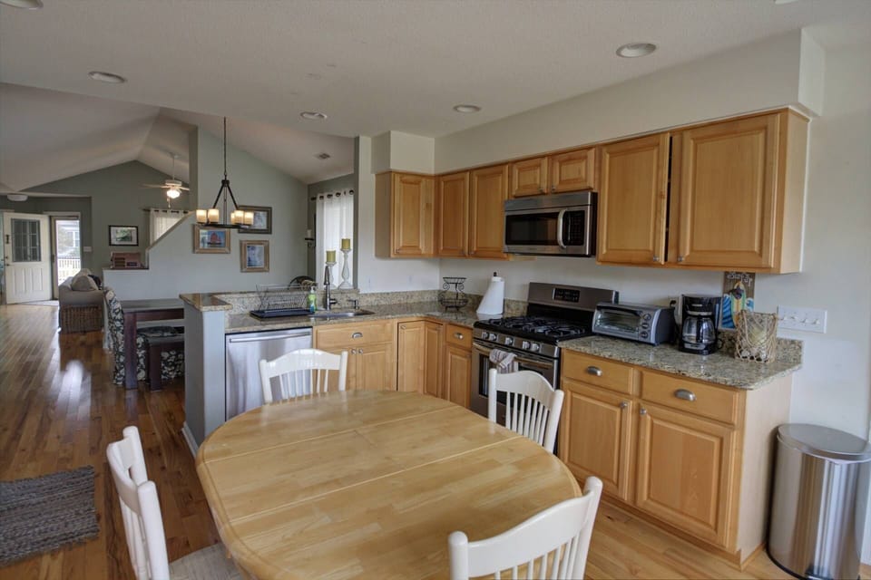 Kitchen comes fully stocked with essentials and breakfast table.