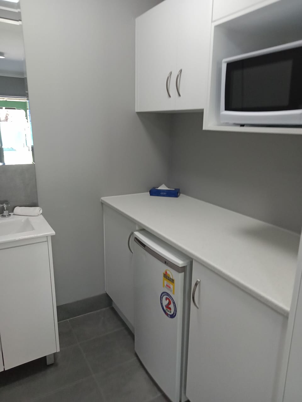 Mini-fridge, microwave, coffee/tea maker, electric kettle