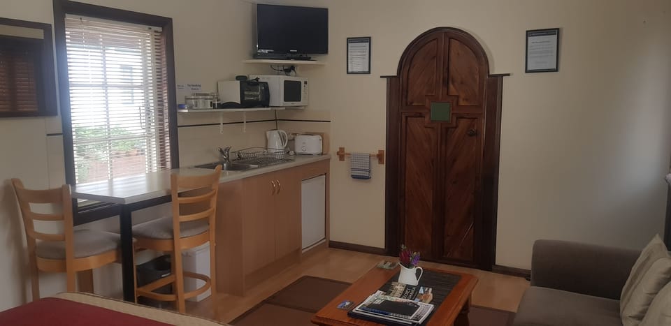 Studio, Kitchenette (The Cellar) | Living area | Flat-screen TV, DVD player