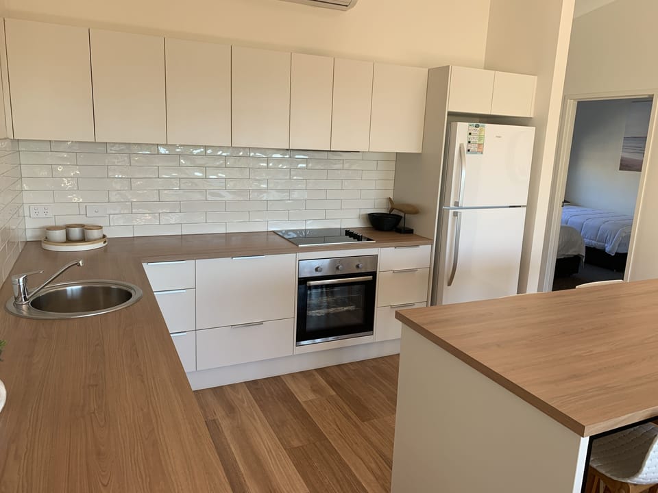 Apartment 5: Upstairs - 2 Bedrooms | Private kitchen | Fridge, microwave, oven, stovetop