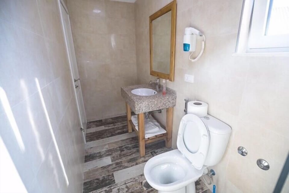 Double Room with Balcony, 204 | Bathroom | Shower, free toiletries, hair dryer, slippers