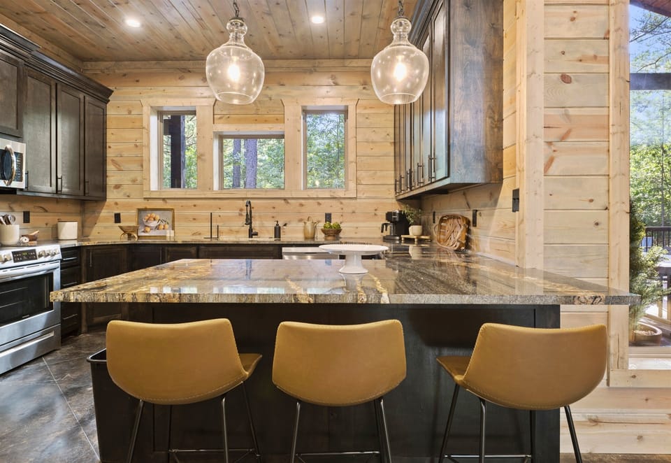 Gather around the island for breakfast or a quick snack in this stylish kitchen.