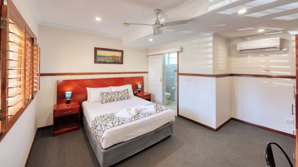 Premium bedding, desk, laptop workspace, iron/ironing board
