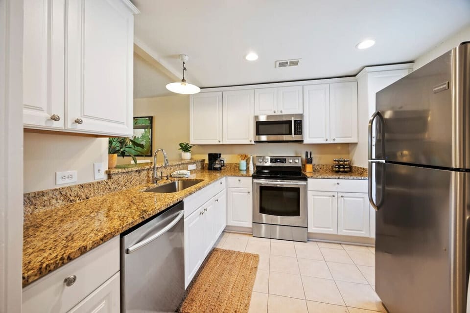 Fully equipped kitchen with modern appliances. Perfect for cooking and gathering.