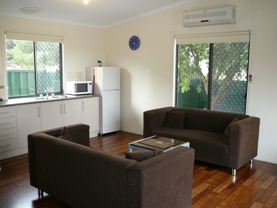 Family Villa | Living area | 32-inch LED TV with cable channels, TV, DVD player