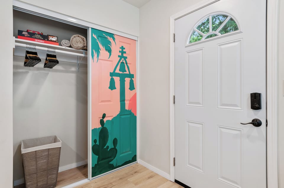 Unique Riverside mural closet w/ laundry hamper, hangers, extra blankets & games