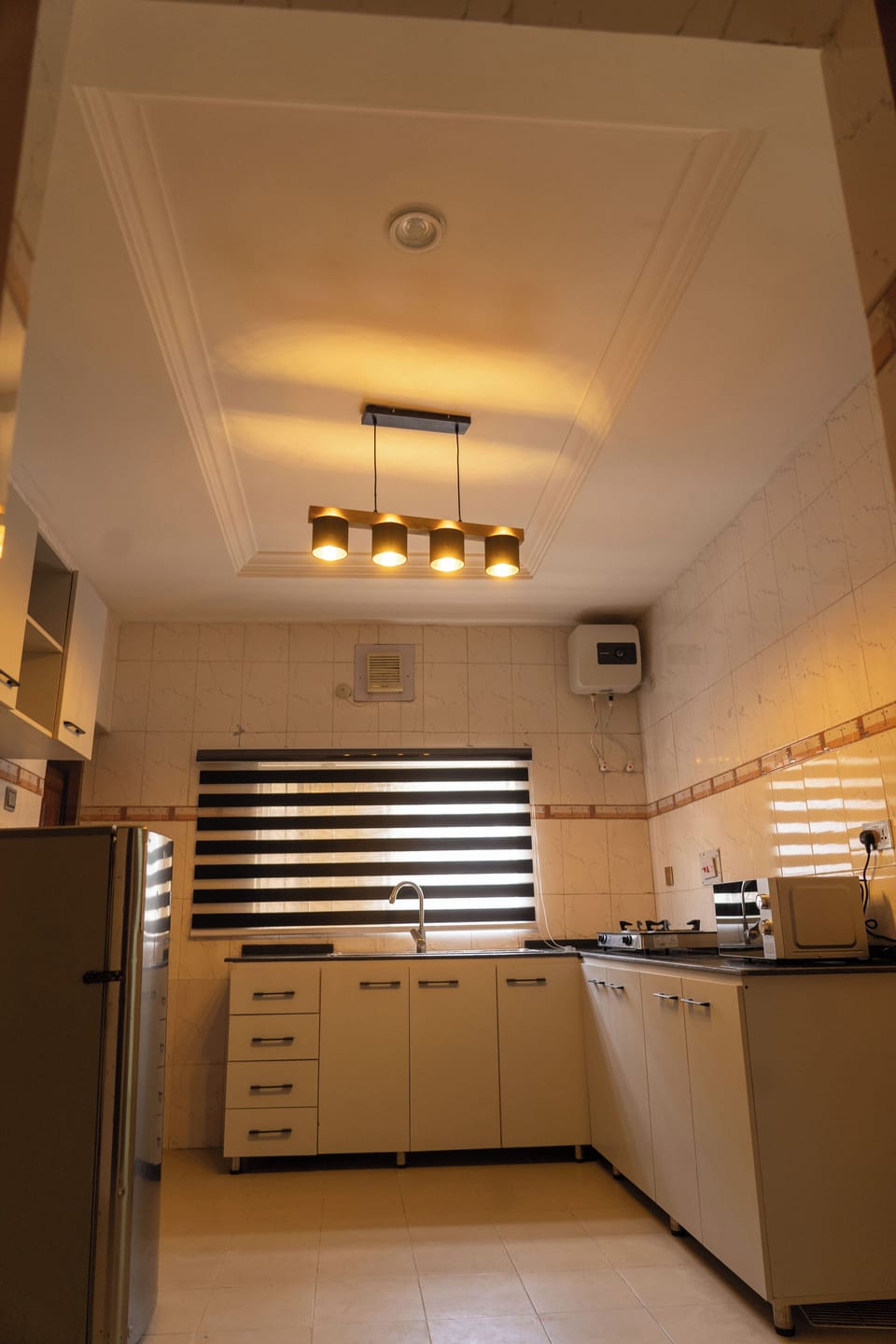Luxury Apartment | Private kitchen | Full-size fridge, microwave, oven, toaster