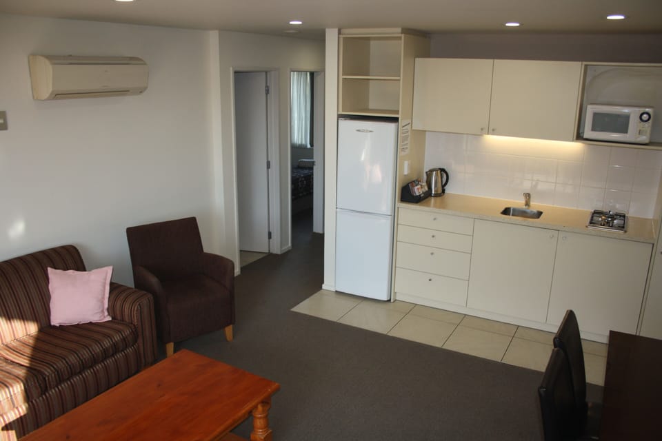 Family Suite, 2 Bedrooms, Kitchenette | Living area | LCD TV