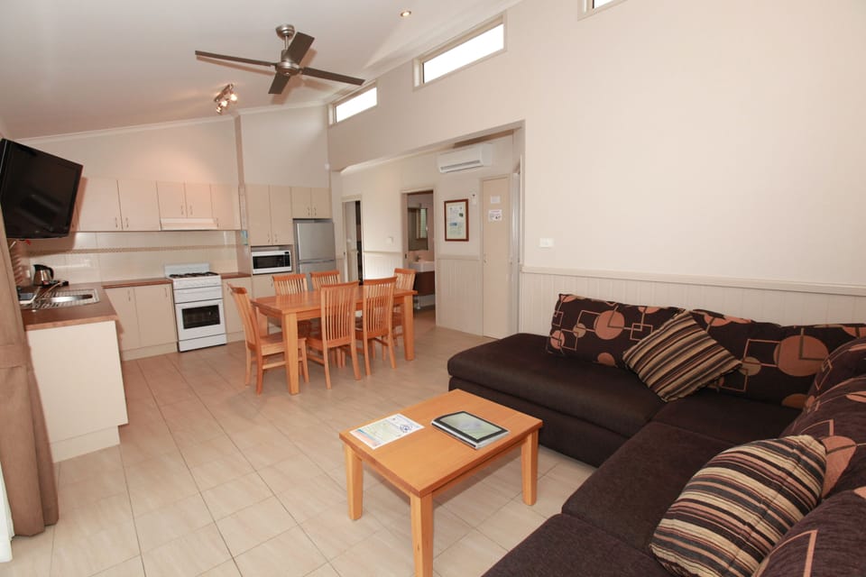 Standard Suite, Multiple Bedrooms, Non Smoking, Kitchen (Elevated Seaside Cabin) | Living area | Flat-screen TV