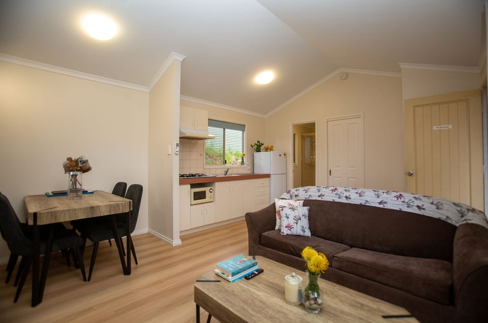 1 Bedroom Standard Cabin | Living area | 40-inch flat-screen TV with digital channels, TV
