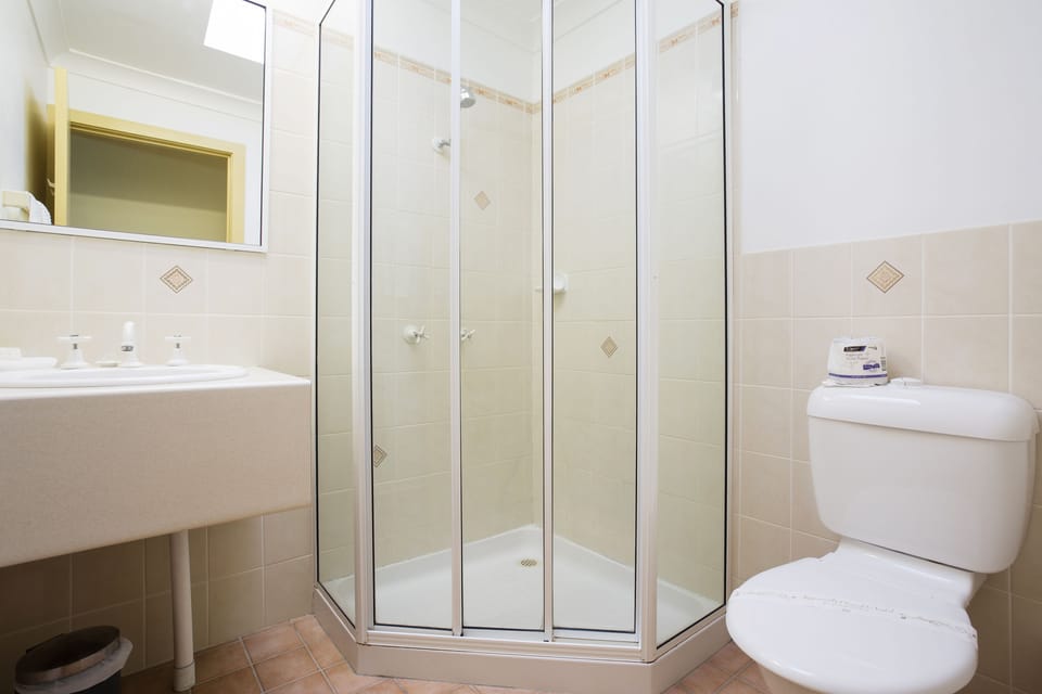 Family Suite, Patio, Ground Floor | Bathroom | Shower, free toiletries, hair dryer, towels